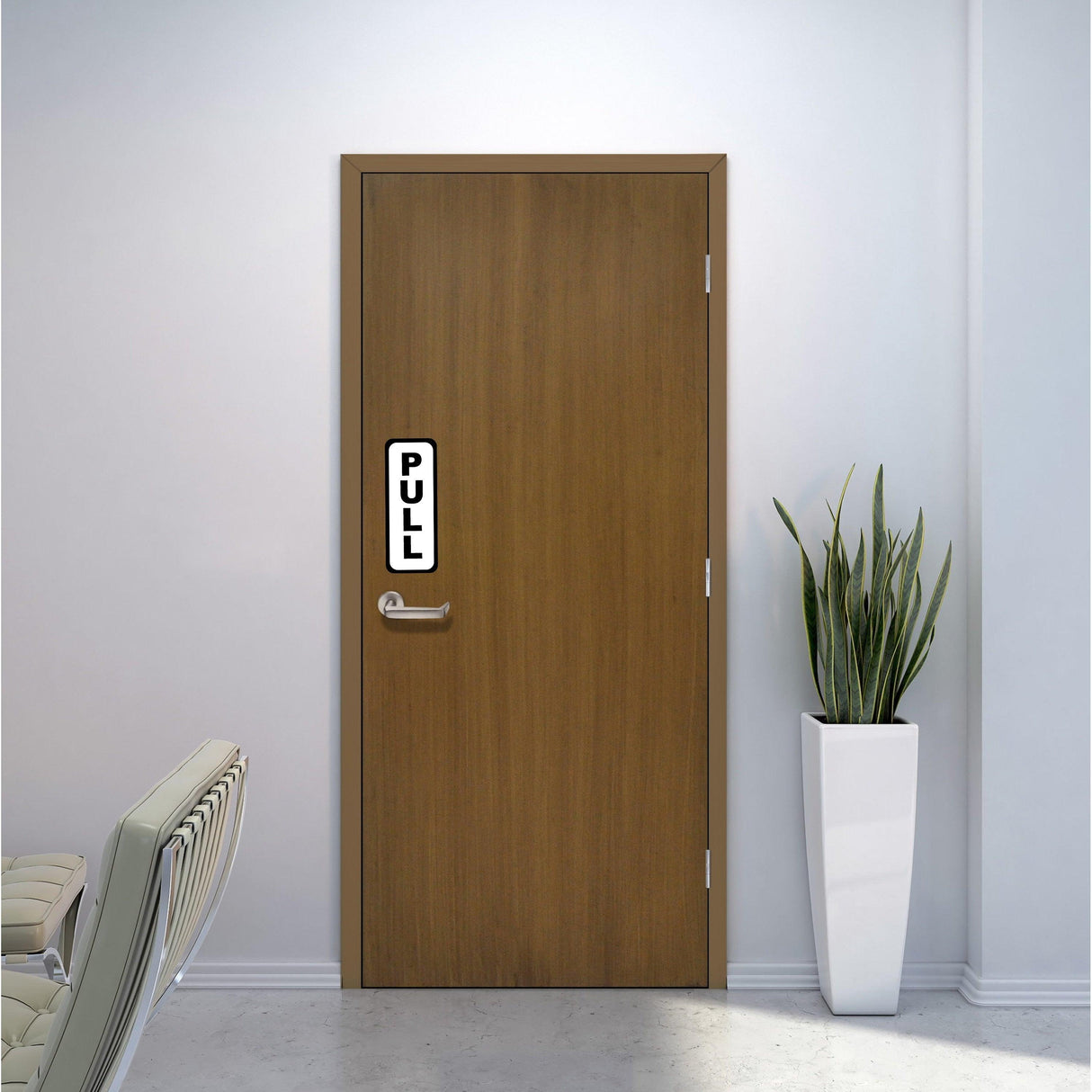 Vertical vinyl decal sign on wooden door indicating 'PULL' for easy access in a modern interior.