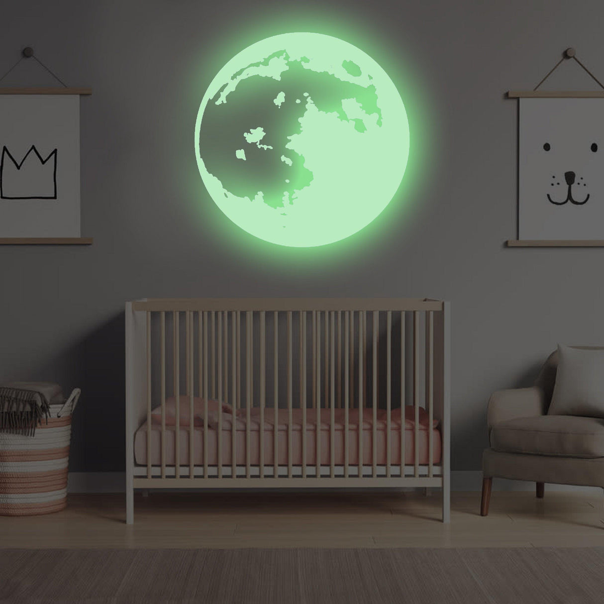 Glow in the dark moon wall sticker above a crib in a child's bedroom, creating a magical atmosphere.