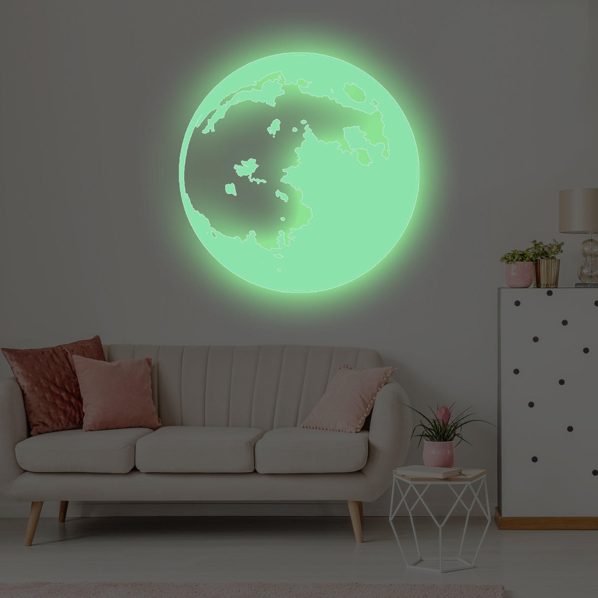 Glow in the dark moon wall sticker illuminating a cozy living room with soft seating and decor.