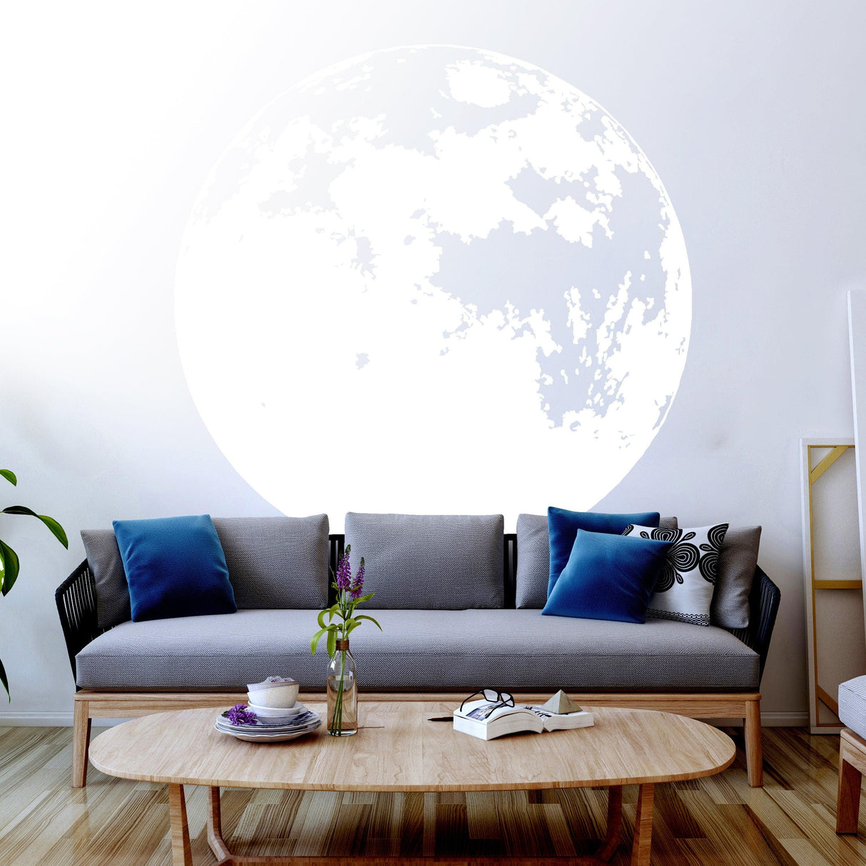 Glow in the dark moon wall sticker above a modern sofa, creating a magical ambiance in a stylish living room.