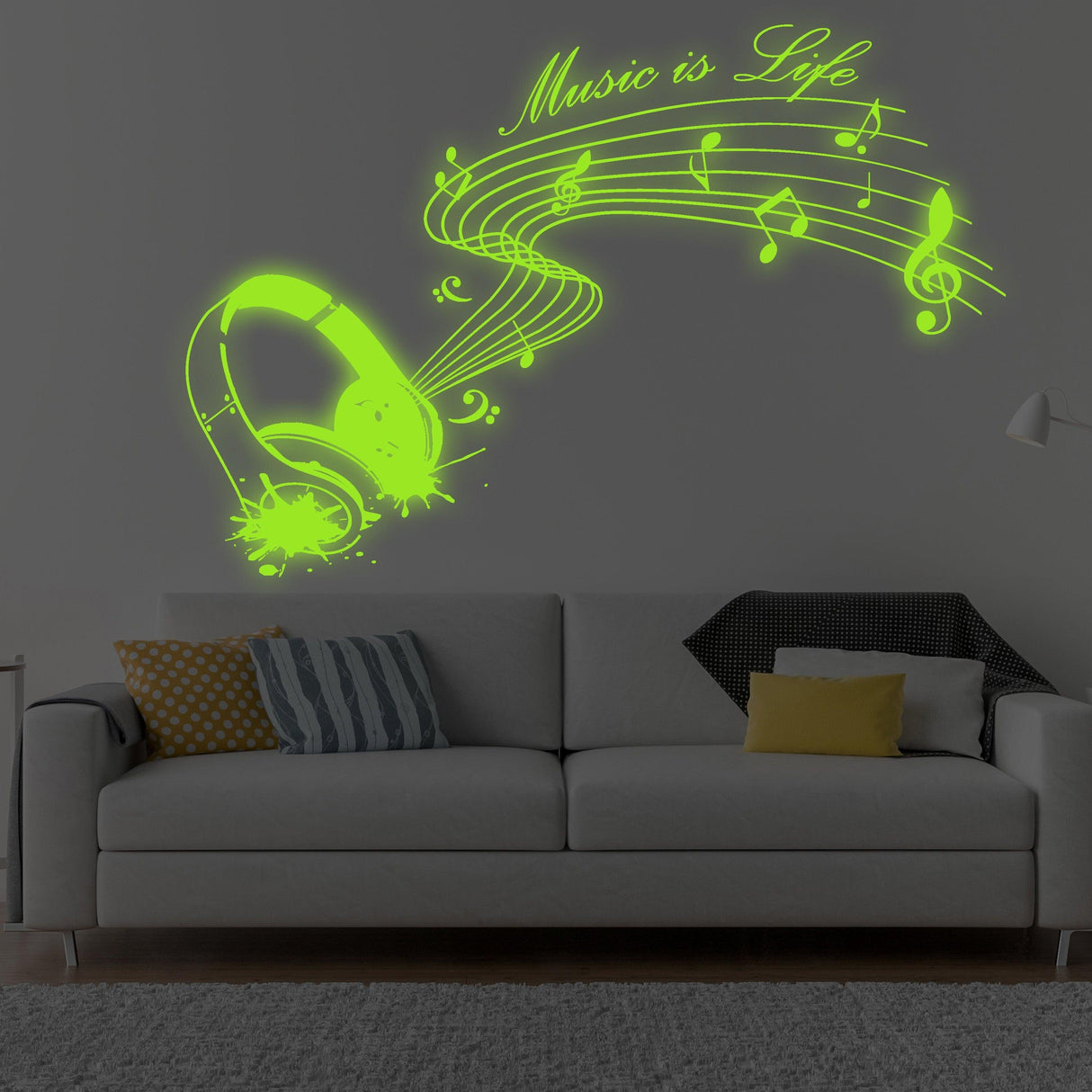 Glow in dark 'Music is Life' wall sticker featuring a headphone and musical notes above a cozy couch.