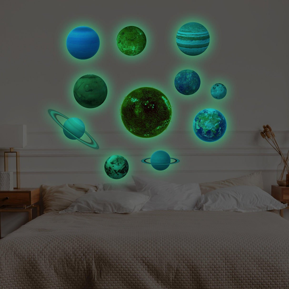 Glow in the dark planet wall decals featuring the solar system on a bedroom wall.