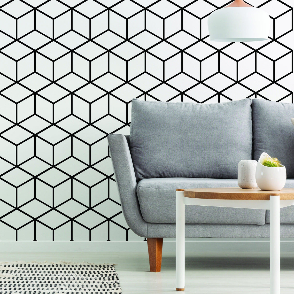 Geometric hexagon honeycomb wall mural decal in modern living space with gray sofa and stylish decor.