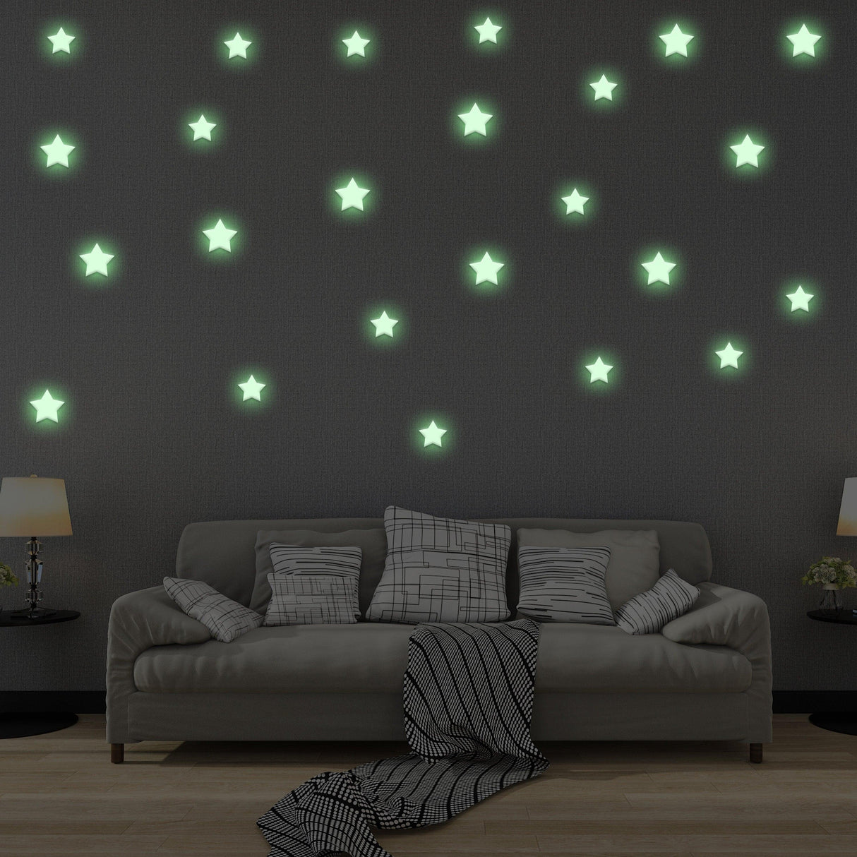Glow in the dark star stickers on dark wall above a cozy couch, creating a magical room decor for kids.