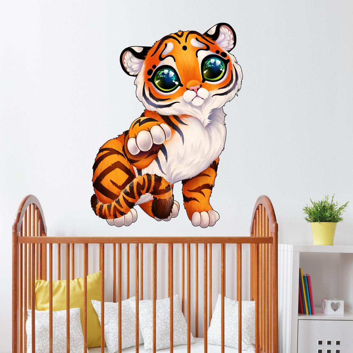 Cute tiger wall sticker in a child's room above a crib, adding a playful and whimsical touch to the decor.