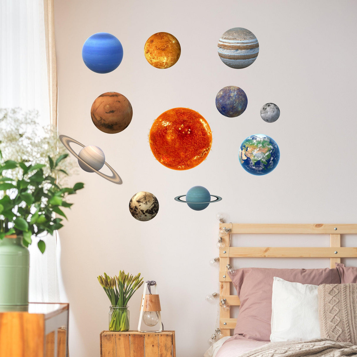 Glow in the dark planet wall decals showcasing the solar system above a cozy bedroom setting.