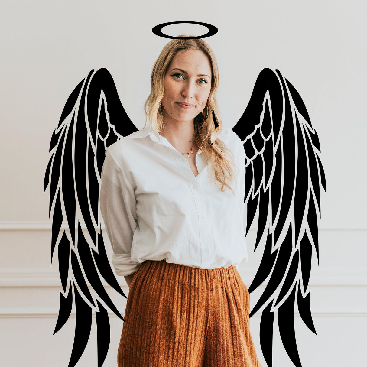 Woman with angel wings vinyl decal wall art, adding a whimsical touch to home decor.