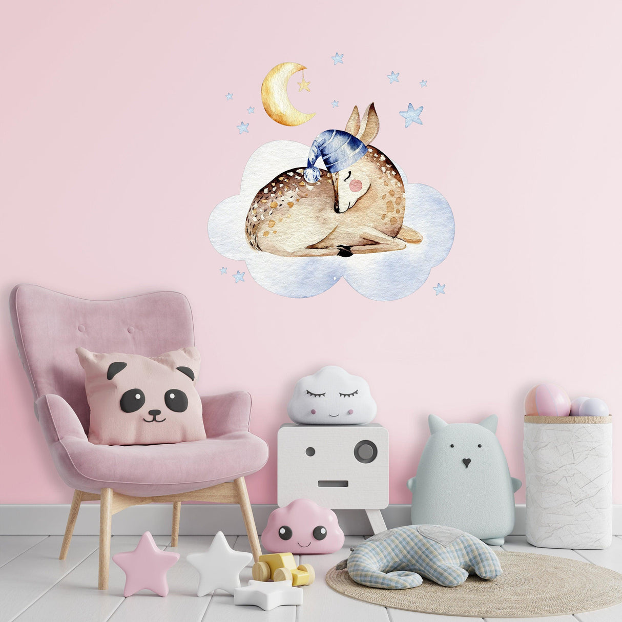Dreamy deer wall sticker on pink nursery wall, featuring clouds, stars, and a moon, creating a whimsical decor.