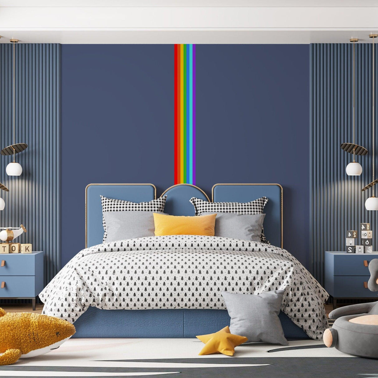 Vibrant rainbow stripe wall decal in a stylish nursery featuring modern decor and cozy bedding.