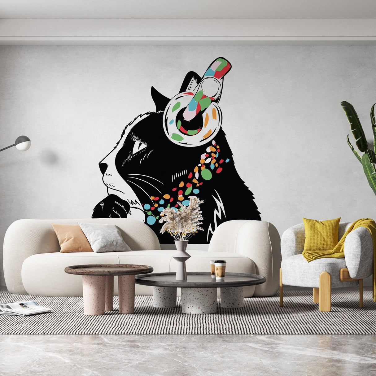Wall decal of a playful black cat wearing colorful headphones in a modern living room setting.