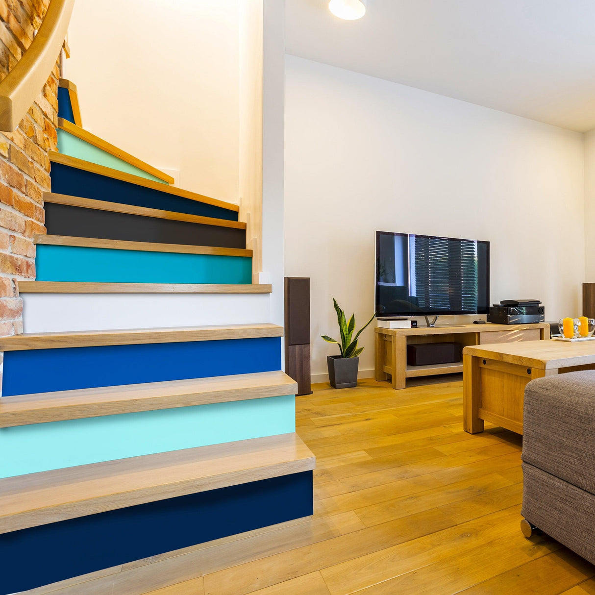 Colorful gradient self-adhesive stair risers enhancing home decor in a modern living room setting.