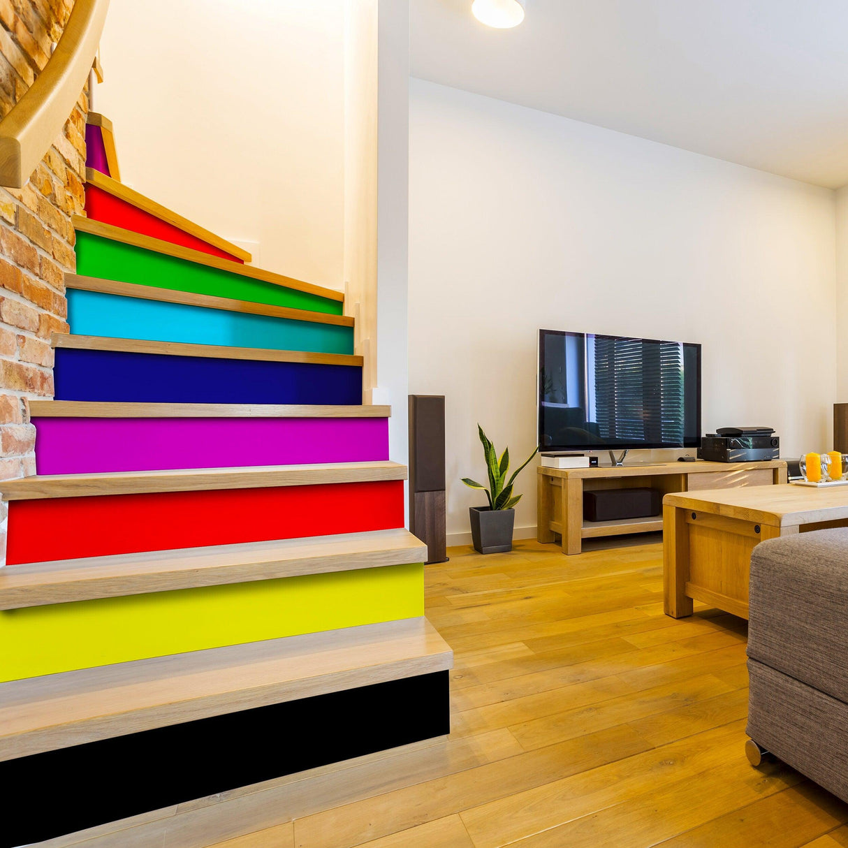 Vibrant rainbow self-adhesive stairs risers stickers on modern staircase, enhancing home decor.