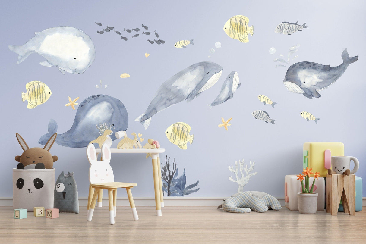 Ocean whales wall sticker featuring vibrant fish theme in a kids room, perfect for baby boy nursery decor.