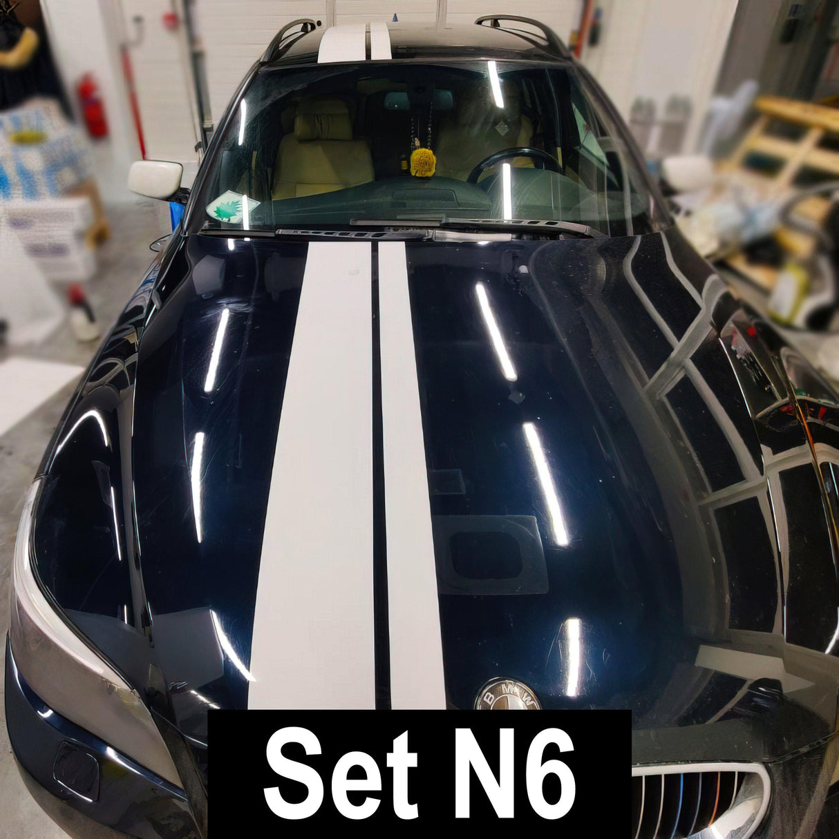 Racing stripes car stickers on a dark-colored vehicle showcasing sleek design and vibrant colors.