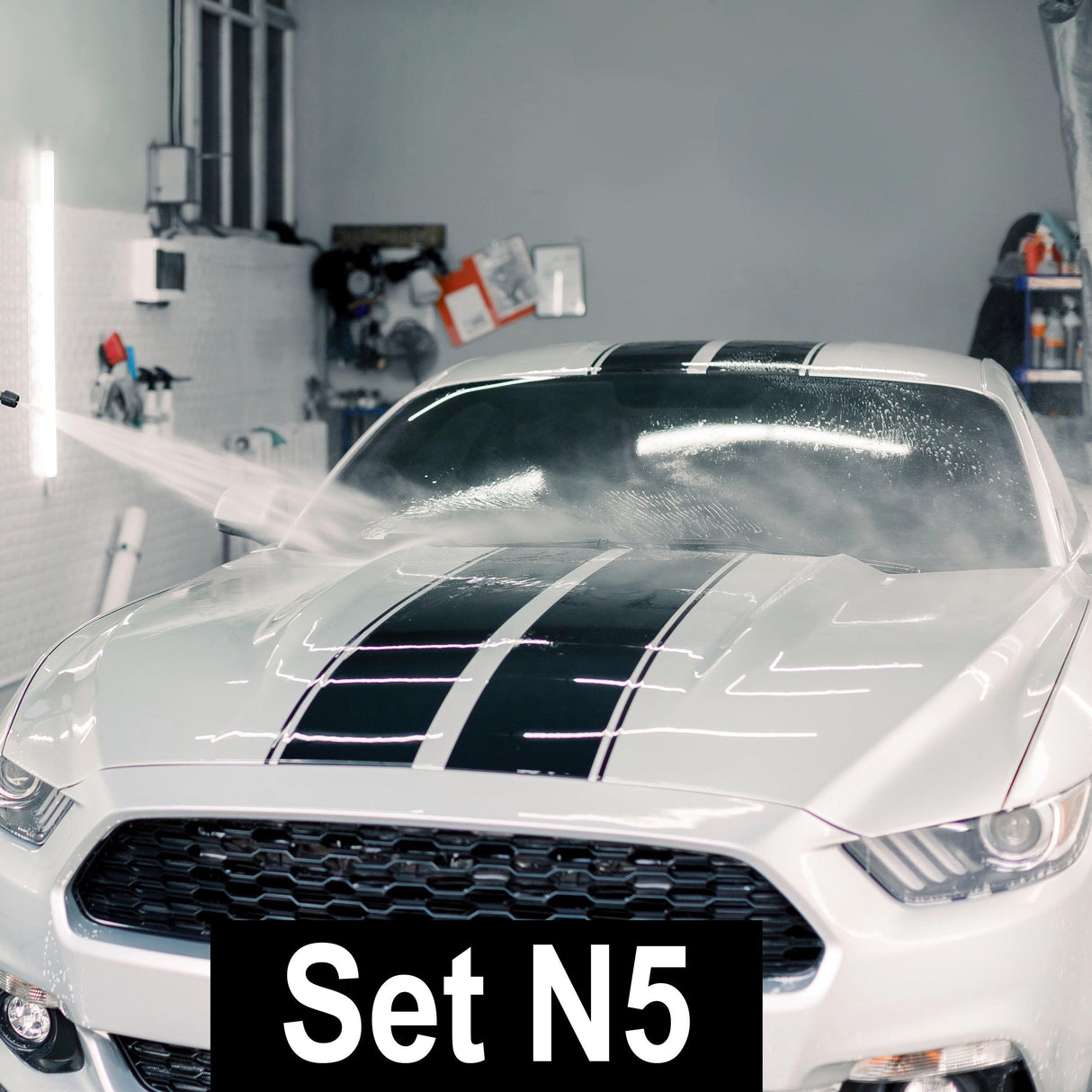 Racing Stripes Car Stickers on a white car being washed, showcasing sleek design and high-quality vinyl.