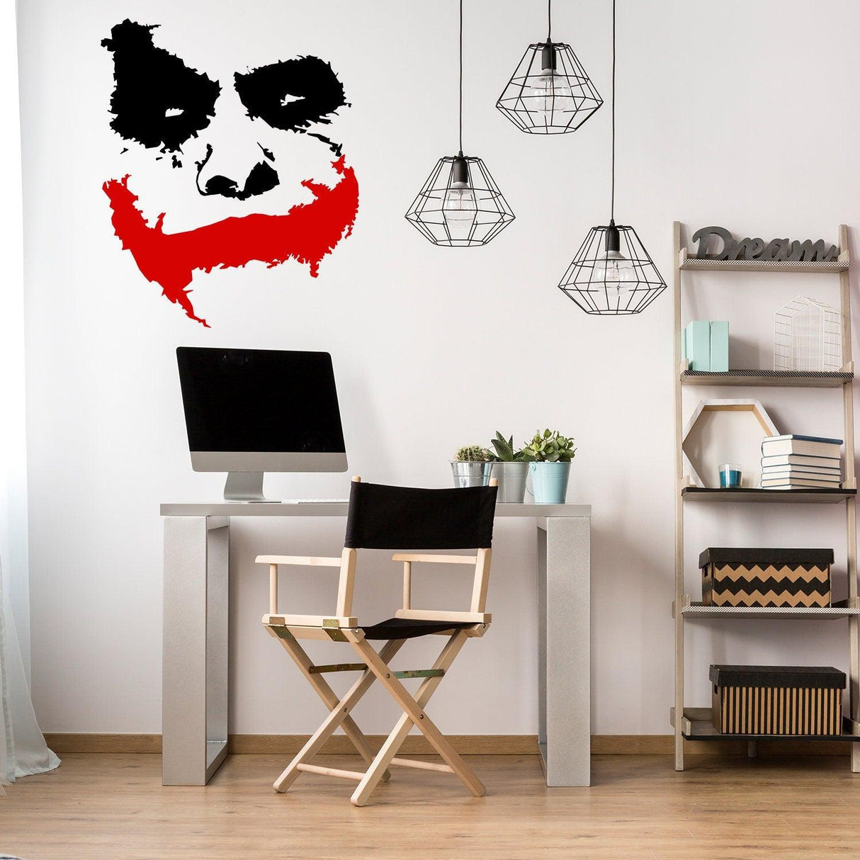 Joker wall sticker featuring a laughing clown face in black and red vinyl for home decor.