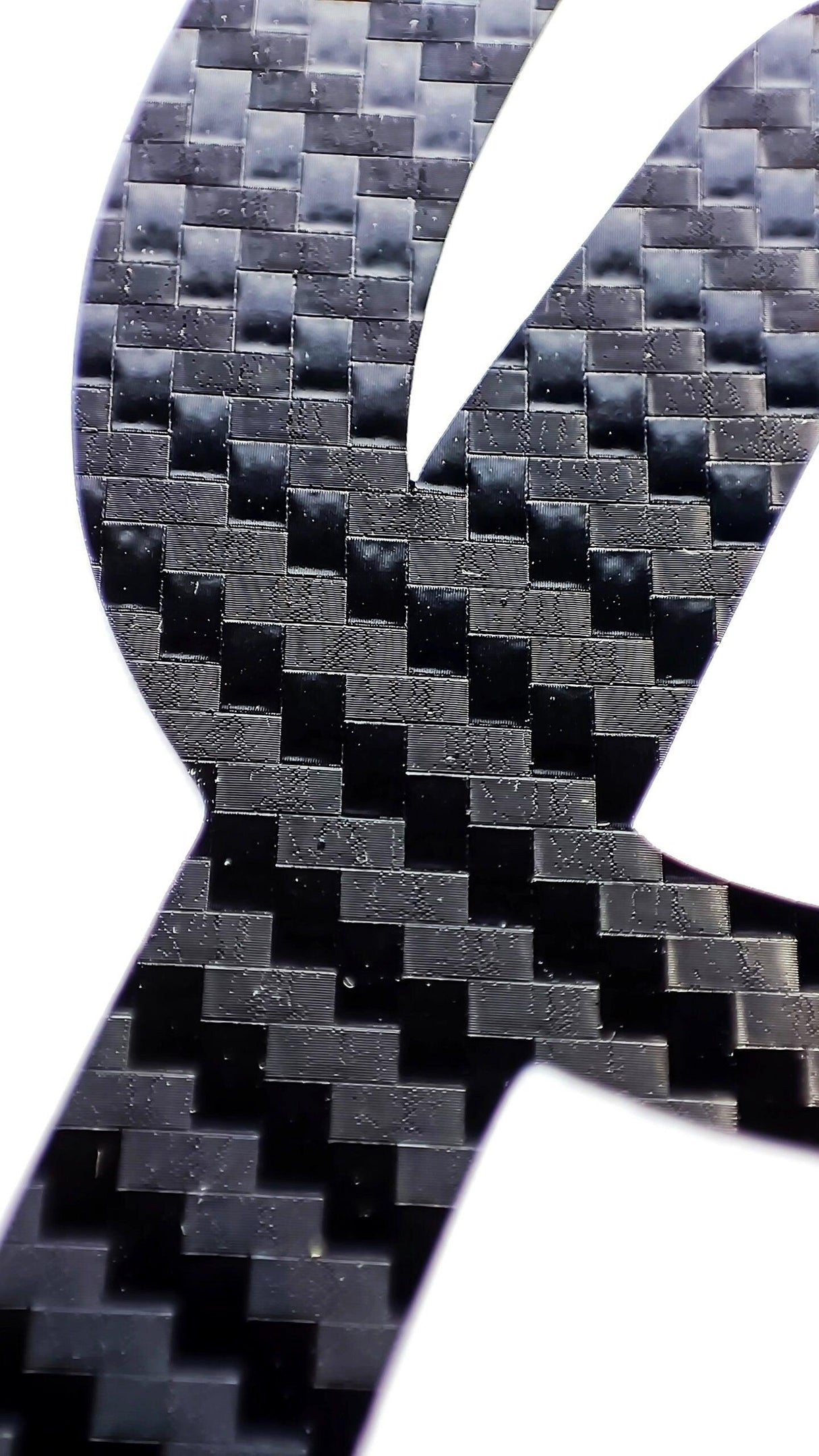 Close-up of personalised vinyl name decal made from durable carbon fibre material.