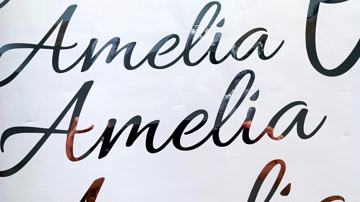 Personalized vinyl name sticker featuring the name 'Amelia' in elegant script style.