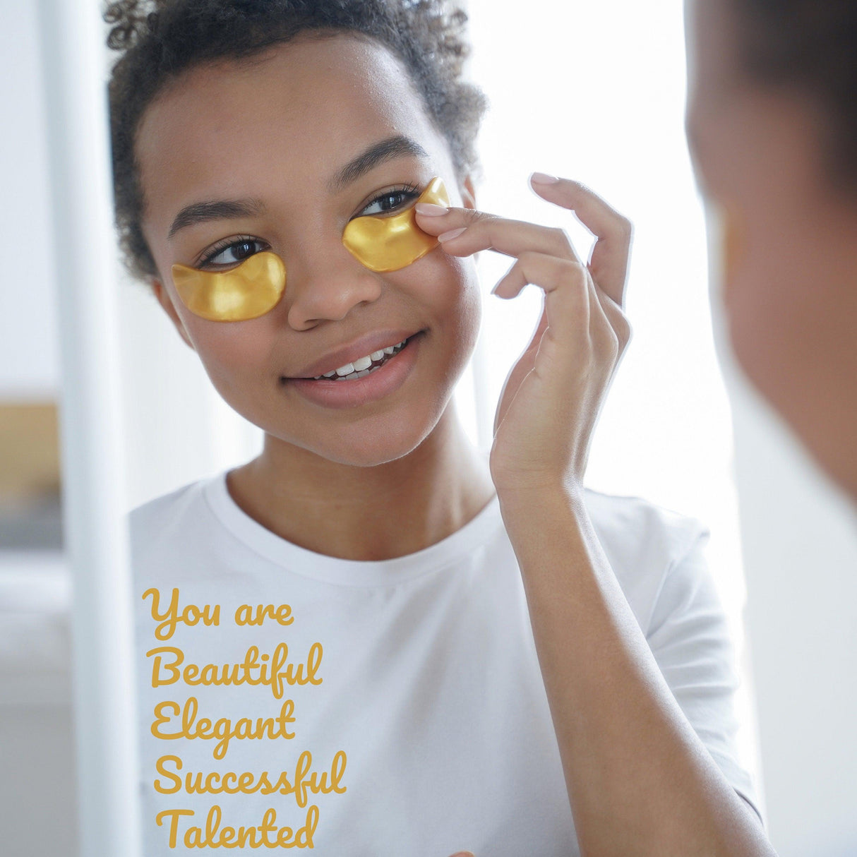 Young person applying eye patches in front of a mirror with positive affirmation text on it.