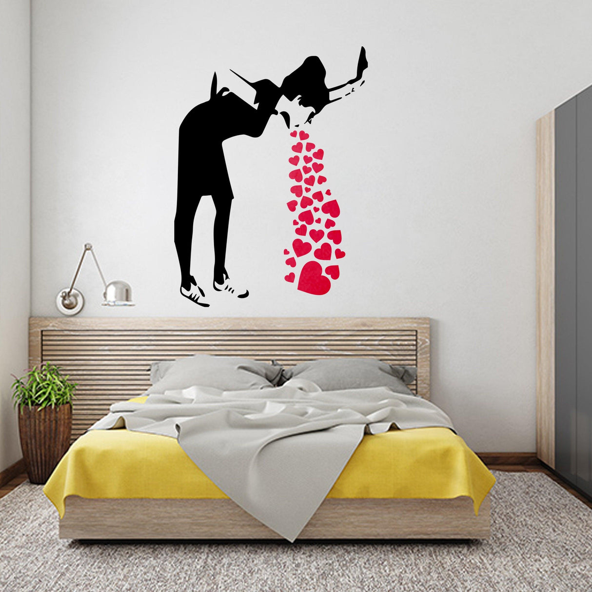Banksy Love Sick Girl wall decal in bedroom, featuring hearts and urban street art vibe.