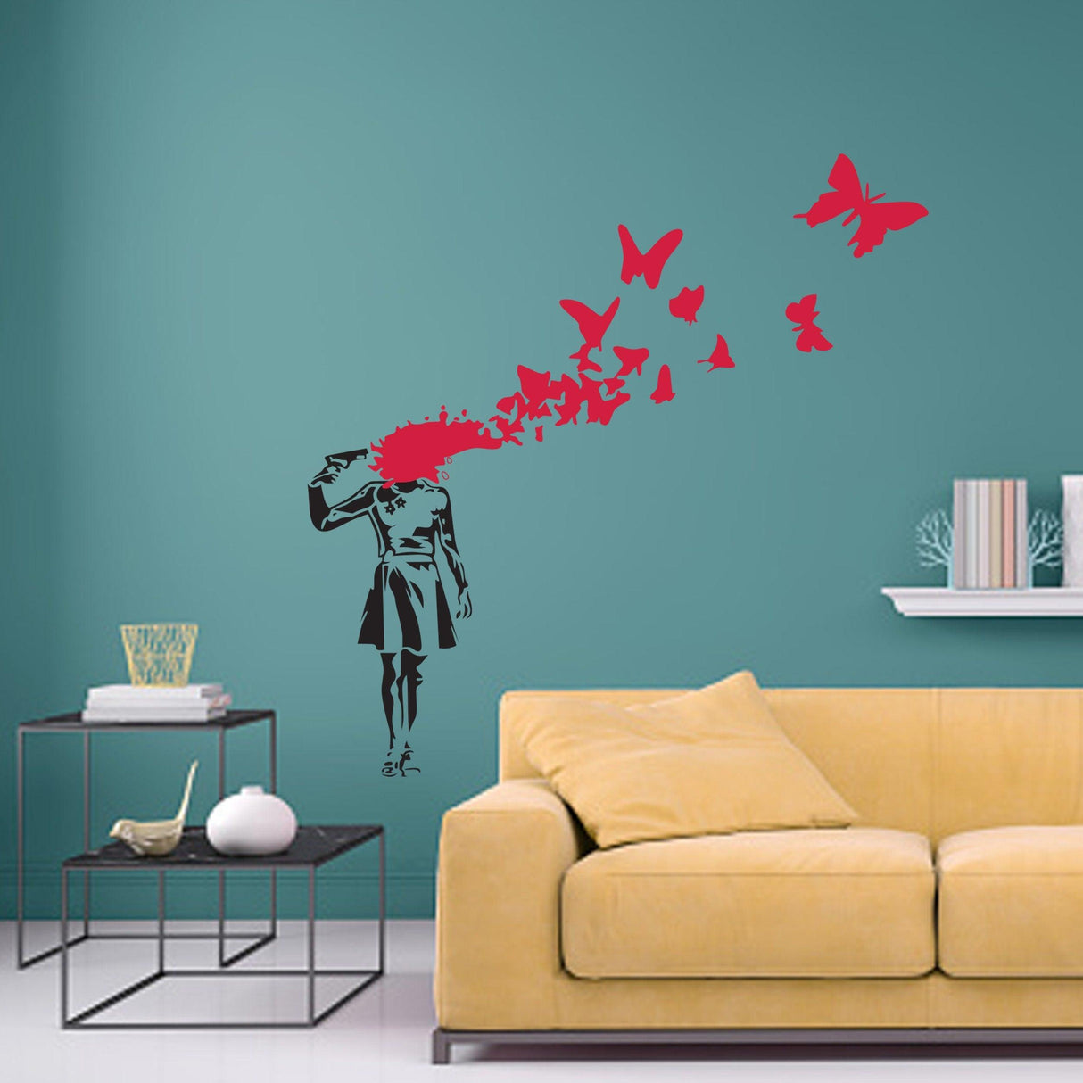 Banksy-style wall decal of a girl with butterflies and gun, adding edgy art to modern room décor.