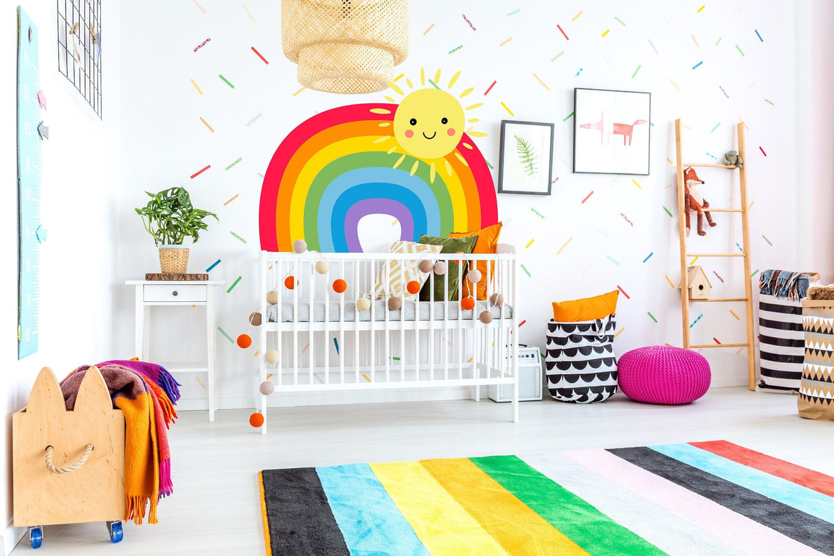 Colorful nursery with rainbow wall sticker, crib, and playful decor creating a cheerful atmosphere for a baby's room.