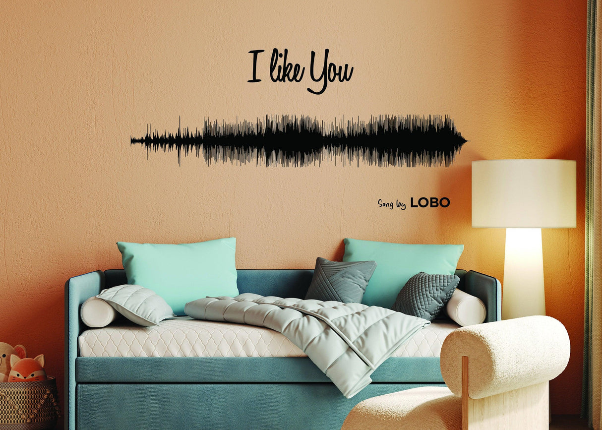 Custom sound wave wall decor showcasing the phrase 'I like You' from the song by Lobo in a stylish living room.