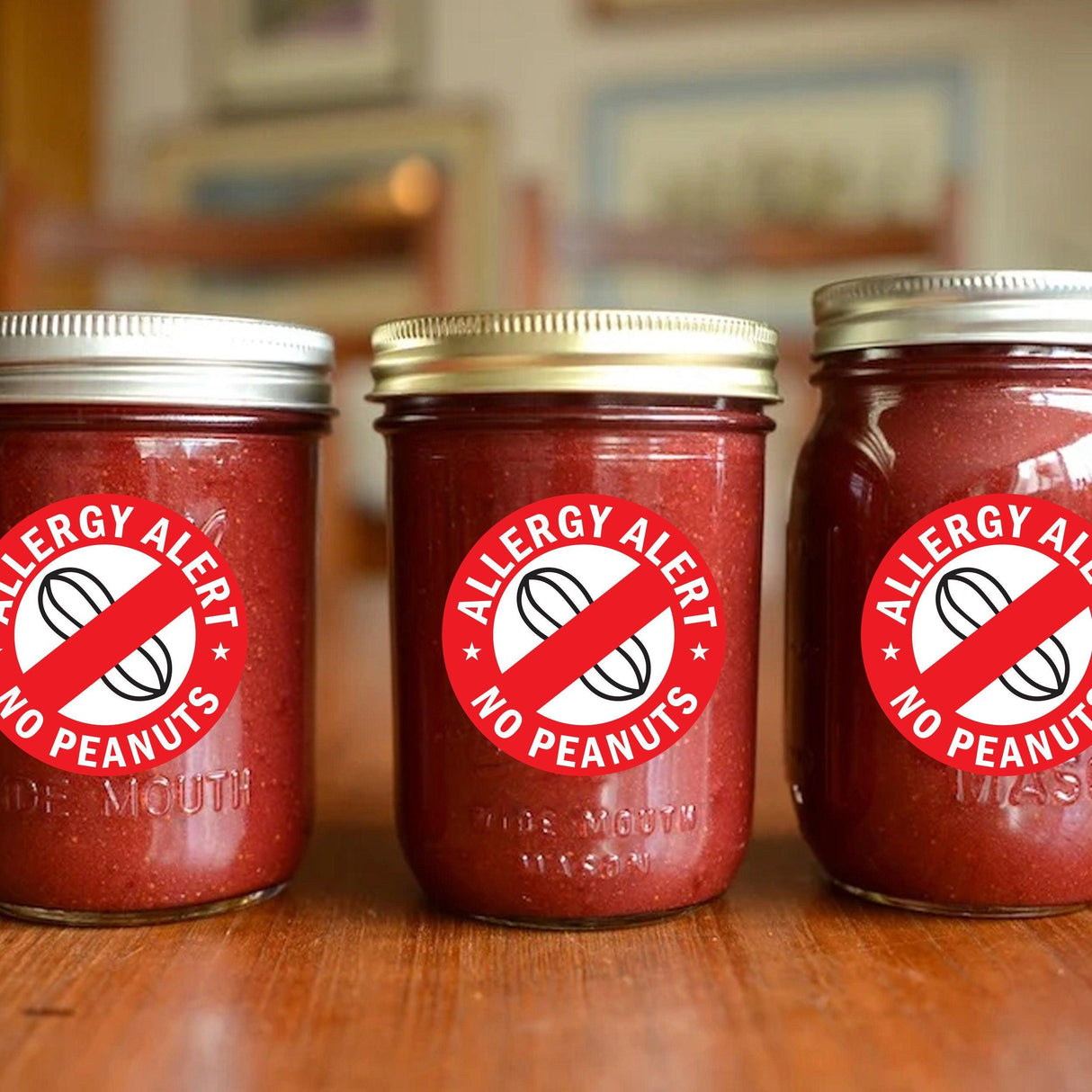 Three jars of red sauce with 'Allergy Alert No Peanuts' stickers for peanut sensitivity warning.