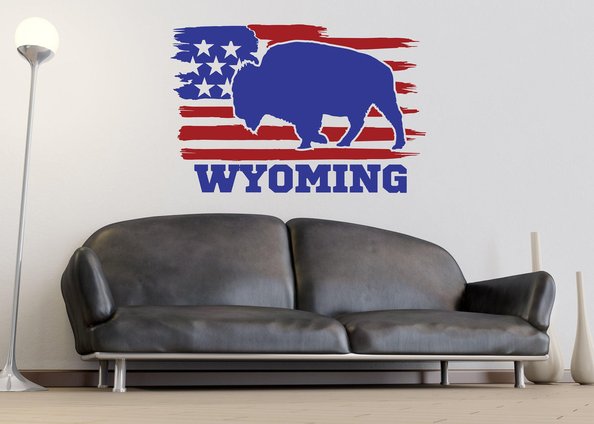 Wyoming decal featuring a blue bison silhouette on a red and white distressed American flag background.
