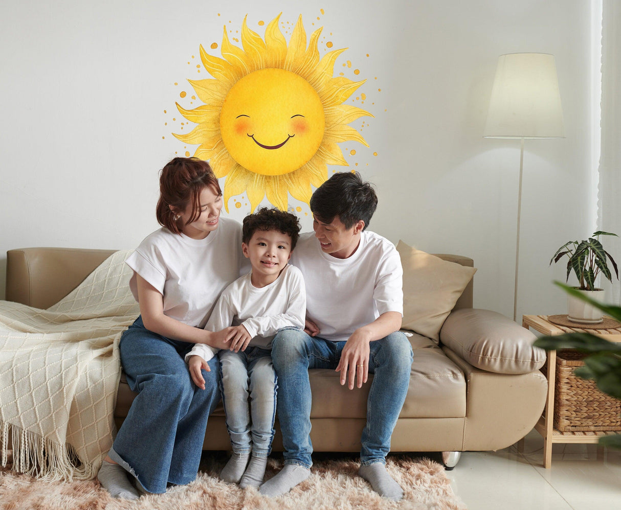 Family enjoying a joyful moment under a cheerful watercolor sun wall sticker in a cozy living room.