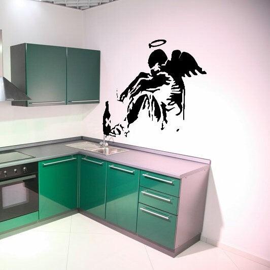 Banksy Fallen Angel Wall Decal on kitchen wall, urban art decor for modern spaces.