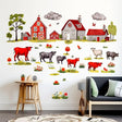 Farmyard wall decals featuring colorful cows, barns, and countryside scenes for a whimsical kids room decor.