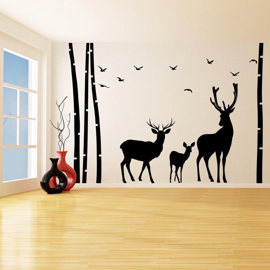 Deer and moose vinyl wall decal in a birch tree forest, ideal for nursery or kids room decoration.