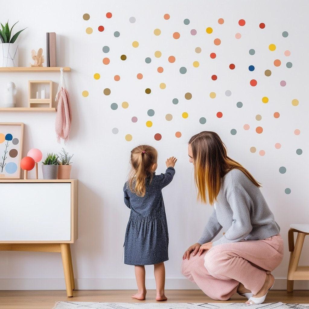 Mom and child enjoying colorful round dot decals in a bright kids playroom, adding a whimsical touch to the decor.