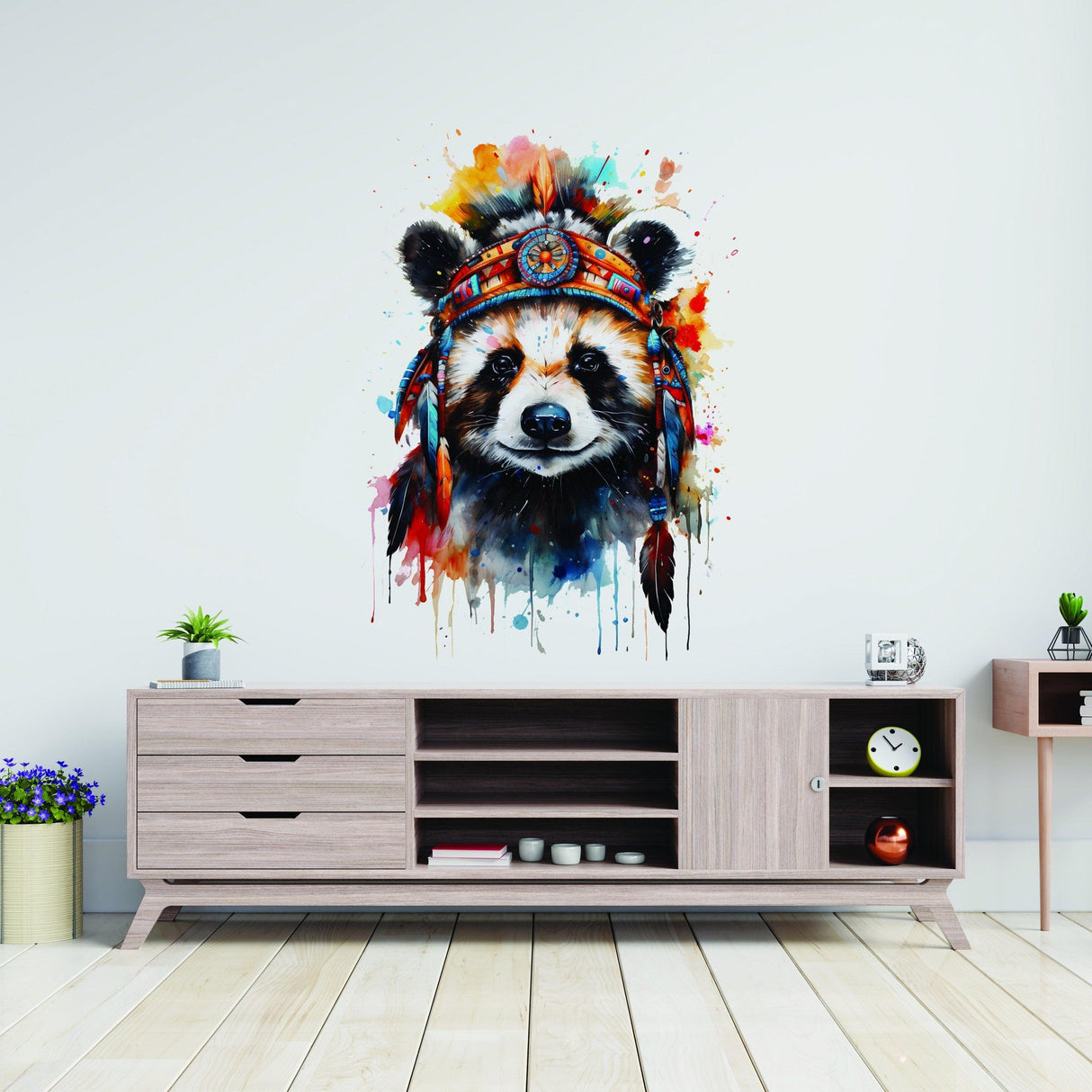 Colorful panda wall decal with a headdress above a stylish wooden cabinet in a modern nursery.