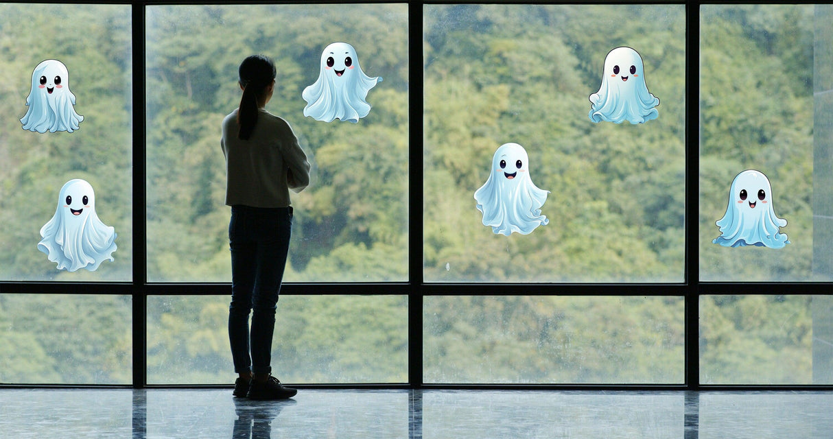 Person admiring spooky 12x Printed White Ghosts Window Decals on large glass windows for Halloween decoration.