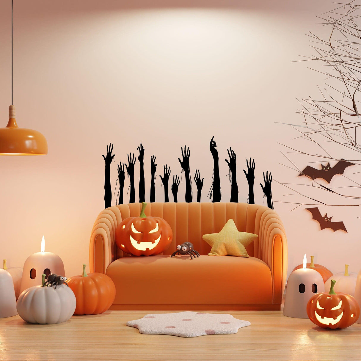 Halloween decor with spooky black zombie hands on wall above orange couch and festive pumpkins.