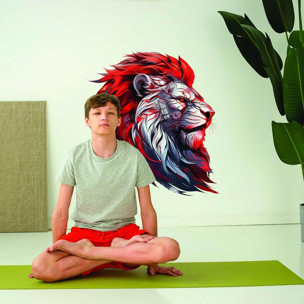 A boy meditating next to a red-maned cybernetic lion head wall decal, blending tradition and futurism in home decor.