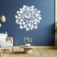 Large white flower wall decal on a blue wall in a stylish living room decor setting.