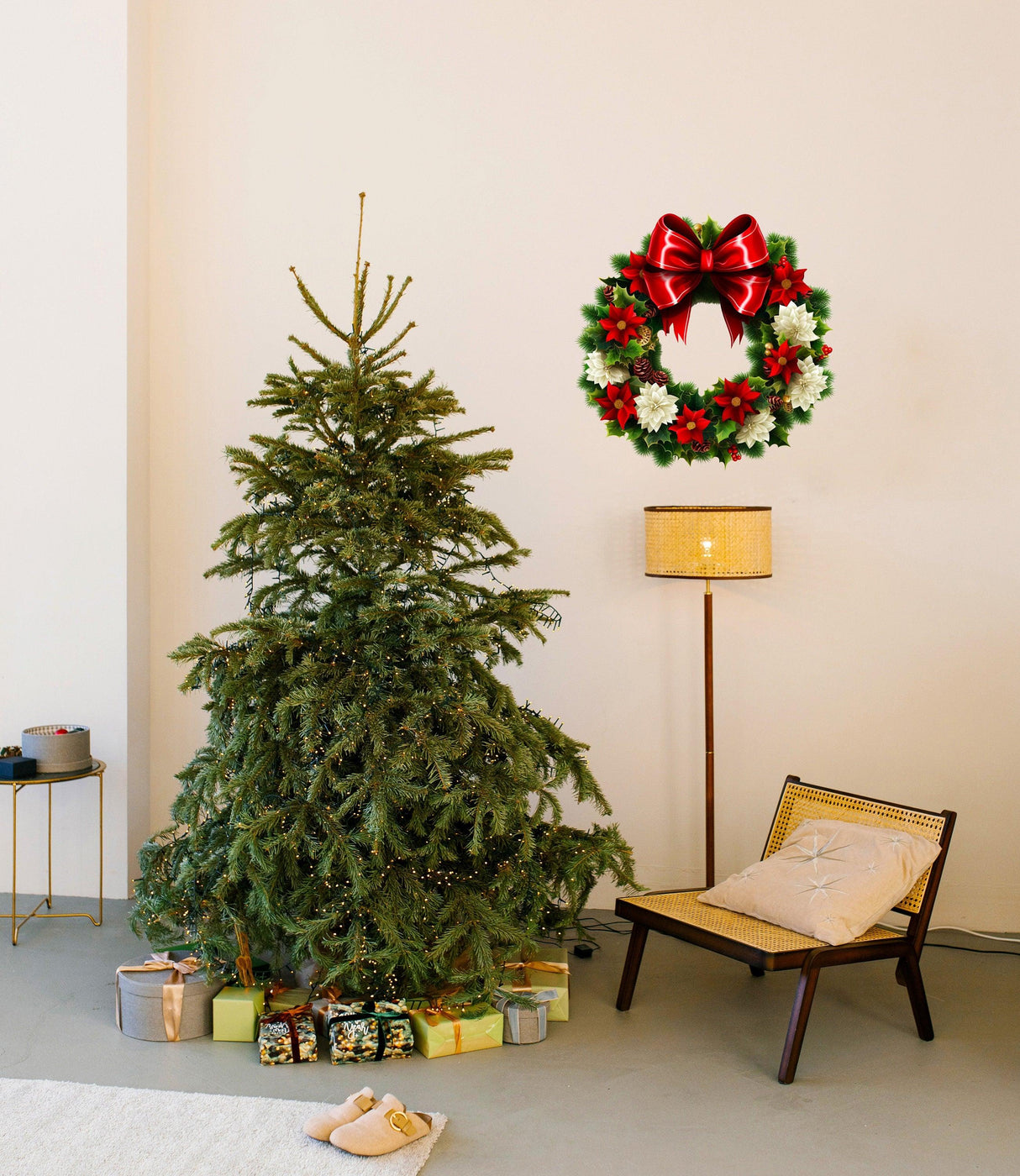 Floral green wreath wall decal with red bow above Christmas tree and gifts, adding festive decor to the room.