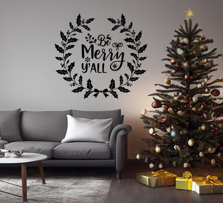 Charming Christmas wall decal 'Be Merry y'all' above a festive tree in cozy living room decor.