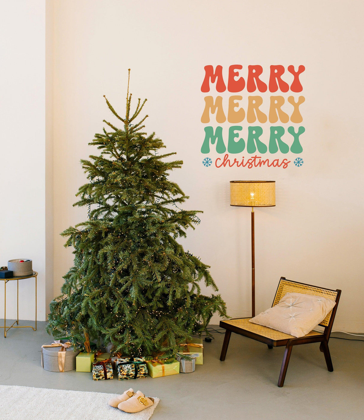 Festive wall decal saying 'Merry Merry Merry Christmas' above a decorated Christmas tree in a cozy living room.