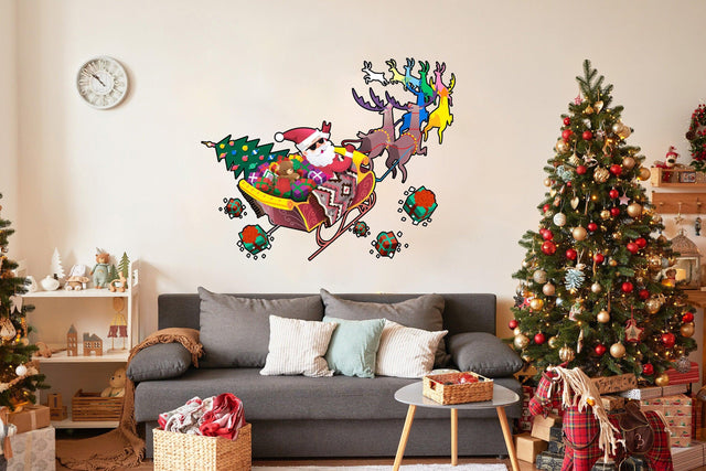 Colorful Santa in glasses in sleigh with reindeer wall decal over festive living room decor for Christmas.