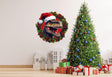 Dino Merry Christmas Wreath Wall Decal featuring a T-Rex in a red hat beside a decorated Christmas tree.