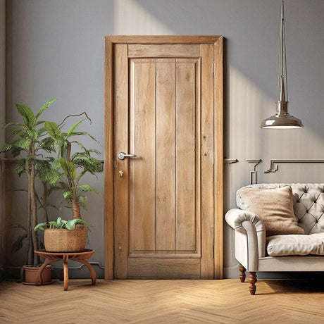 Cozy living room featuring a rustic wood barn door and elegant decor with plants and a stylish sofa.