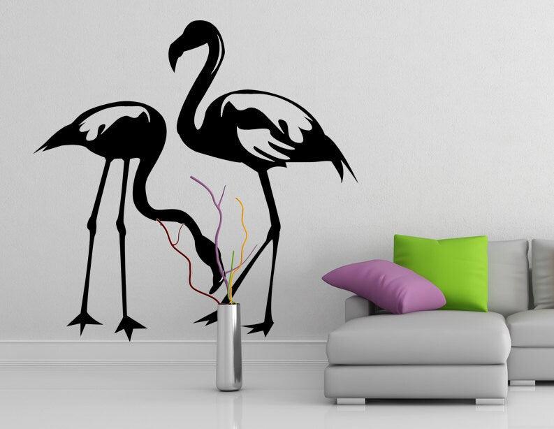Stylish black flamingo wall decal in modern living room with colorful cushions and decorative vase.