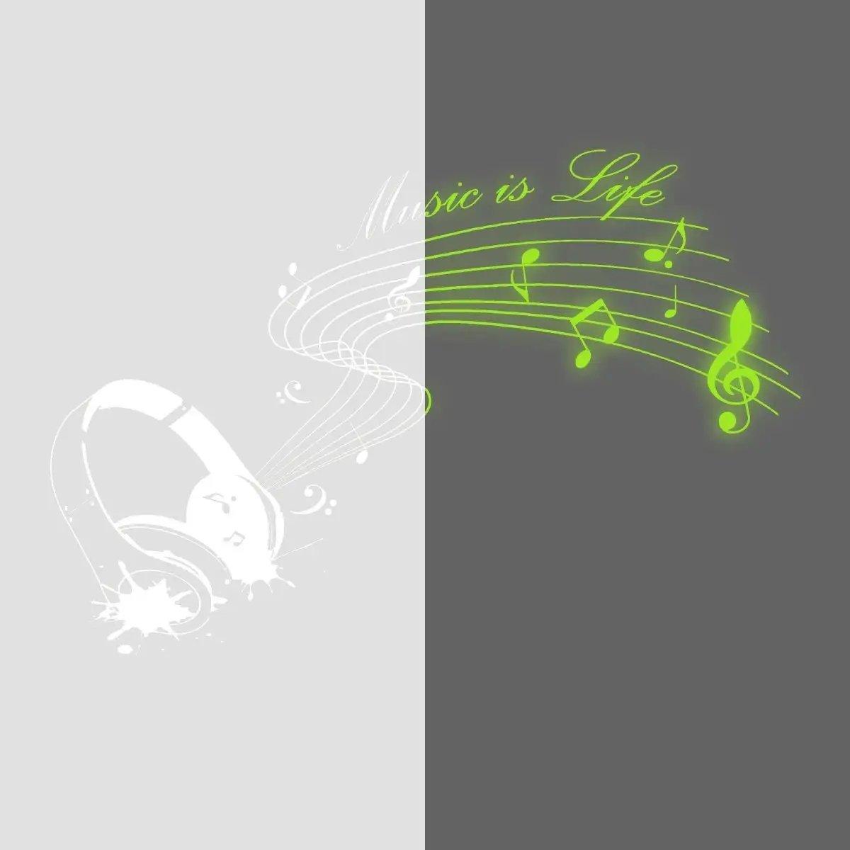 Glow-in-the-dark wall decal featuring headphones and musical notes with the phrase 'Music is Life'.