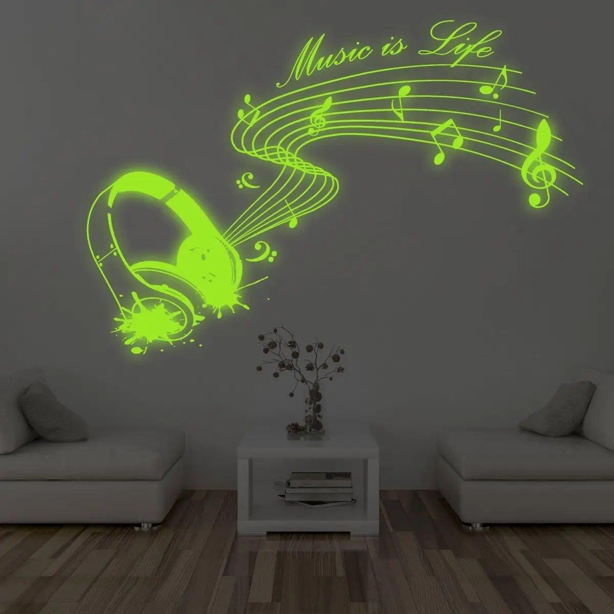 Glow-in-the-dark wall decal of headphones and musical notes, featuring 'Music is Life' text for vibrant room decor.