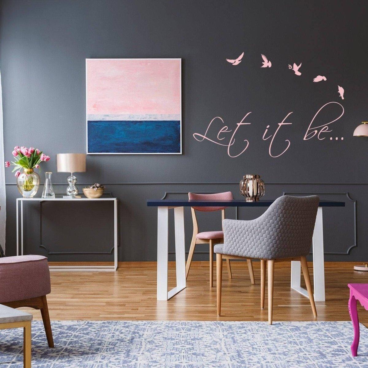 Stylish living space featuring the 'Let it be...' vinyl wall sticker with birds and contemporary decor.