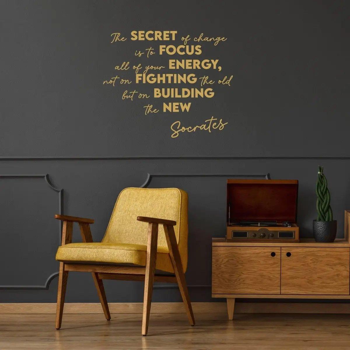 Motivational vinyl decal with Socrates quote on a stylish wall above a yellow chair and retro record player.